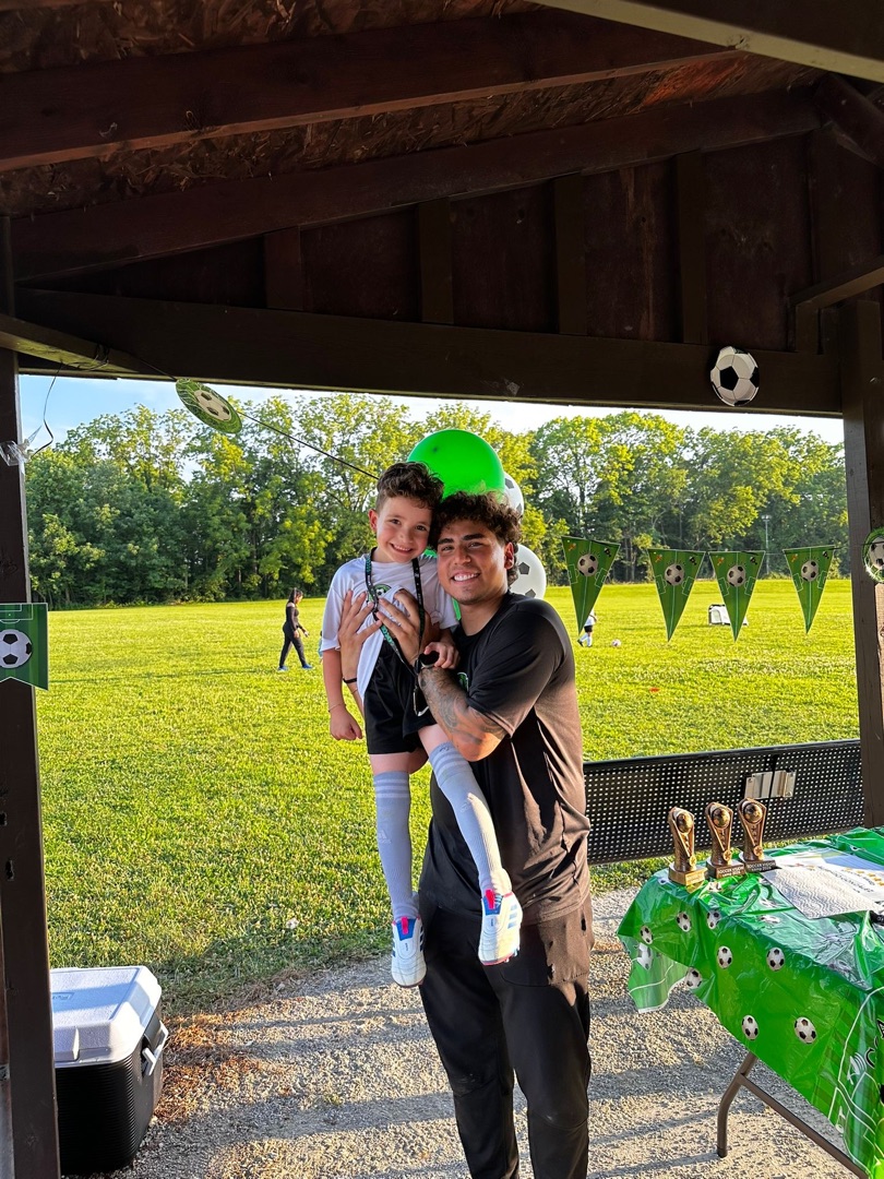 Coach cargando a un jugador